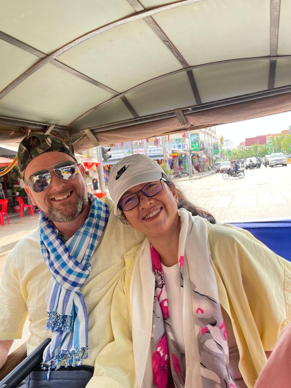 Ian and Neang travelling together in a tuk-tuk
